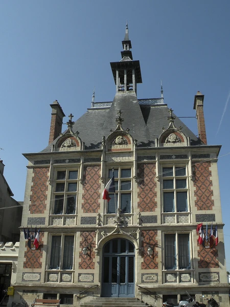 Vue aérienne ou paysagère de Montivilliers montrant l'environnement urbain et résidentiel de la commune (toitures résidentielles, habitat local, paysage urbain caractéristique), représentative d'une zone d'intervention typique pour une entreprise de couverture et isolation de toiture. La photo doit être professionnelle, en lumière naturelle diurne, et montrer clairement le contexte géographique local.